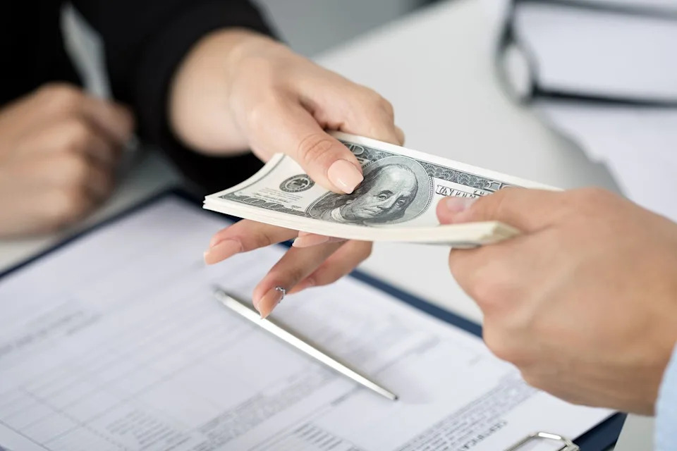 Getty Stock photo of a woman receiving an inheritance
