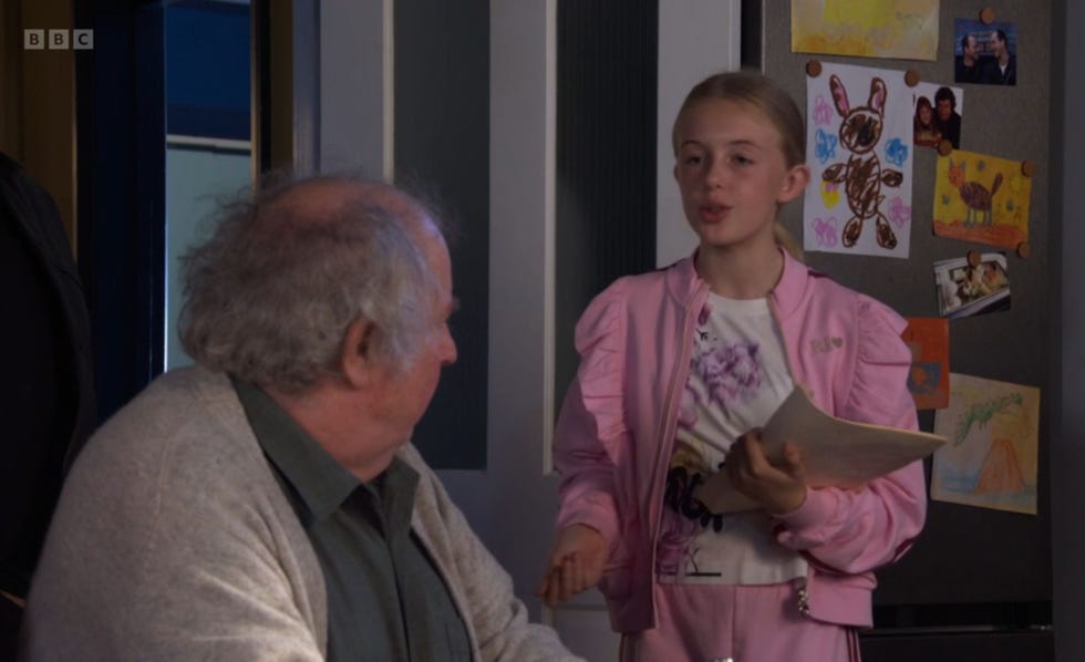 eastenders, nigel bates and lexi mitchell in the kitchenm when lexi holding a script in her hand