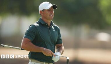 Rory McIlroy holding a putter