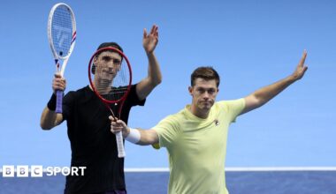 Joe Salisbury and Neal Skupski raise their racquets in celebration