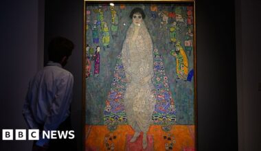 A man looks at Gustav Klimt's Portrait of Elisabeth Lederer with his hands behind his back.