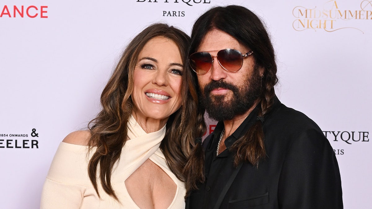 Elizabeth Hurley smiling with boyfriend Billy Ray Cyrus