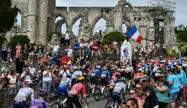 The pack of riders (peloton) cycles past the ruins of the church of Ablain-Saint-Nazaire during the 1st stage of the 112th edition of the Tour de France cycling race, 184.9 km starting and finishing in Lille Metropole, northern France, on July 5, 2025. (Photo by Marco BERTORELLO / AFP)