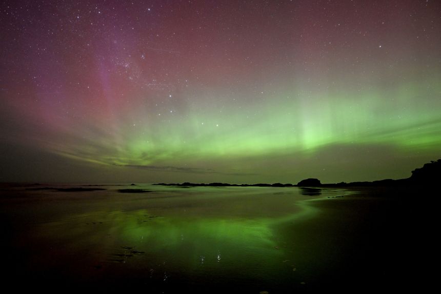 The aurora australis, also known as the southern lights, glowed over the waters of Brighton Beach in Dunedin, New Zealand, on November 13.