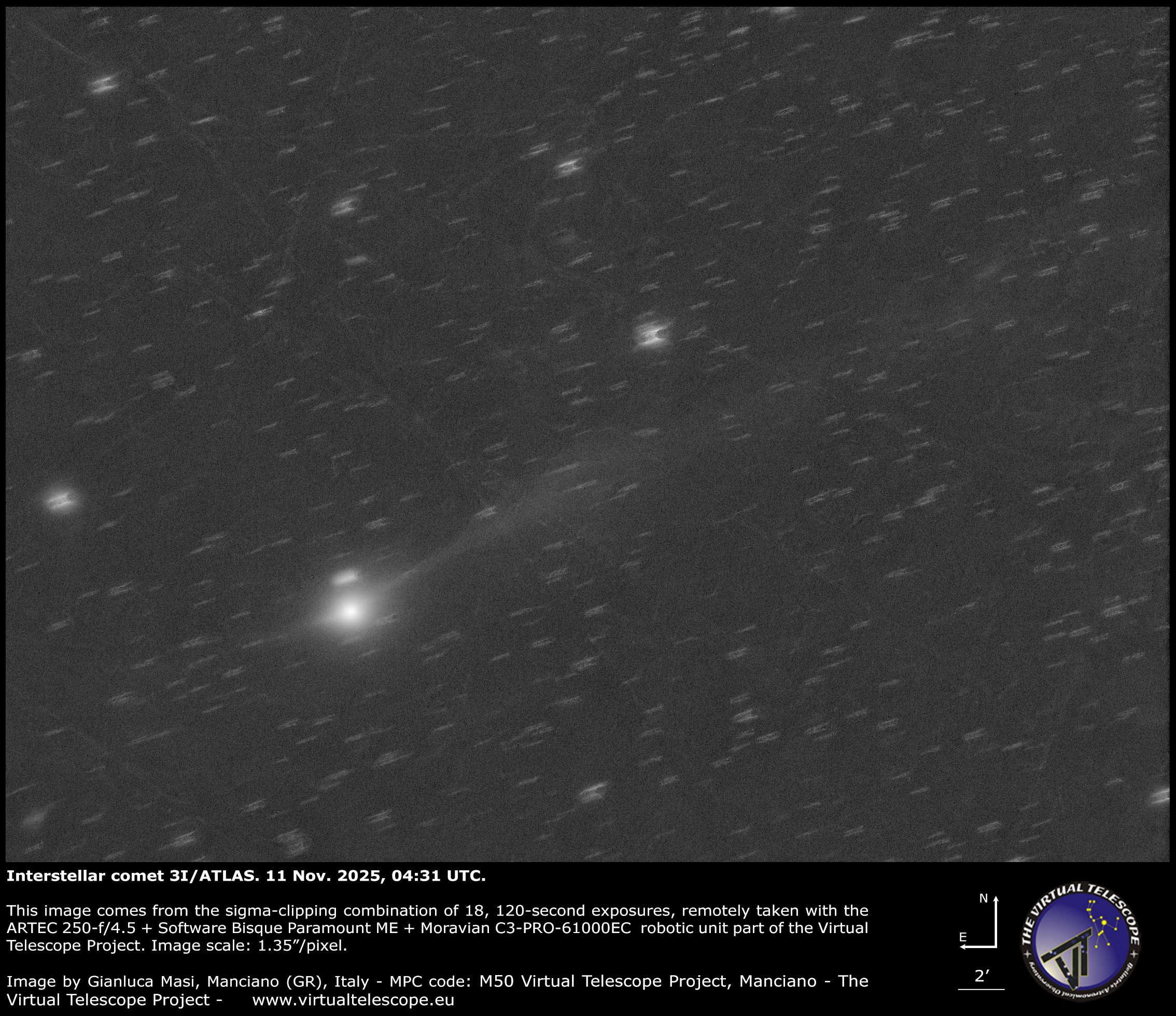 A bright, fuzzy point of light representing a comet's central coma is visible shining to the lower left of an image, with a faint tail extending to the upper left lof the screen. Points of light representing stars are visible in the black sky beyond.
