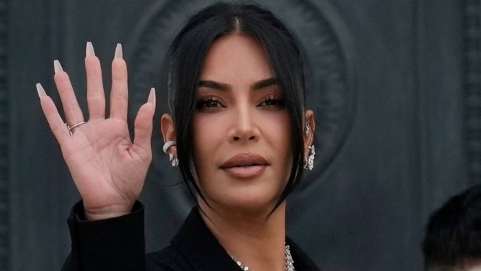 Kim Kardashian waves