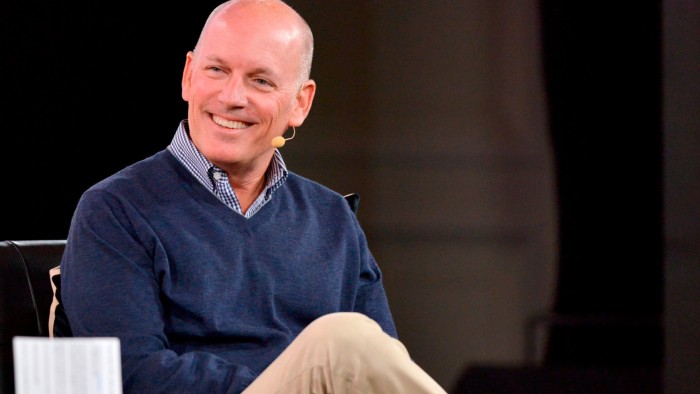 Craig Peters, CEO of Getty Images, smiles while speaking onstage at the 2023 Code Conference.