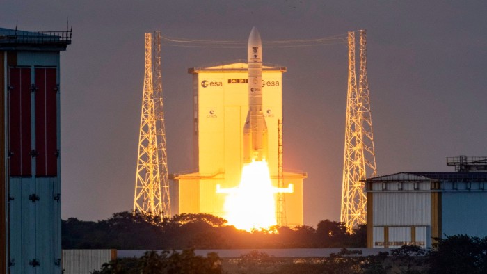 Ariane 6 rocket carrying the Sentinel 1-D satellite launches from the Guiana Space Centre, flames and smoke visible at liftoff