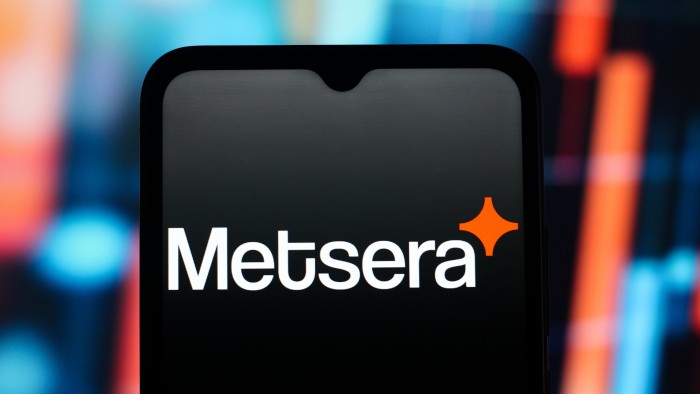 The Metsera logo is displayed on a smartphone screen, with a blurred, colorful background.