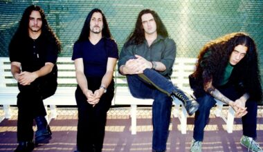 Type O Negative sitting on a bench looking moody
