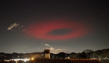 Photographer captures eerie red halo hovering over the Italian Alps in rare 'elve' sighting (photo)