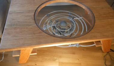 An Improbable, Doomed Star System In A Clockwork Coffee Table