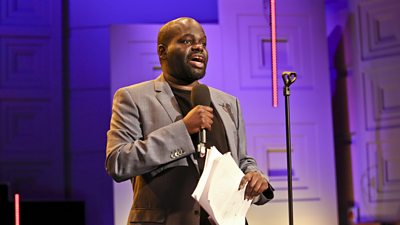 Photo of Daliso Chaponda performing onstage. 