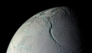 A close up of a gray planet with various streaks and ditches in its surface.