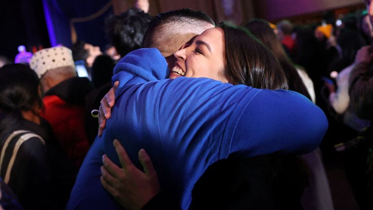 Alexandria Ocasio-Cortez hugs a Zohran Mamdani supporter at a watch party. Pic: Reuters