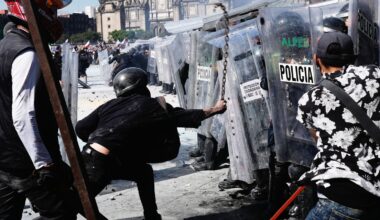 A protester strikes at riot police with a metal chain during a youth anti-government protest in Mexico City. Pic: AP