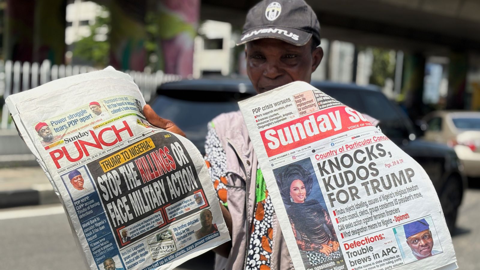 A vendor sells local newspapers in Lagos, AP Photo/Sunday Alamba