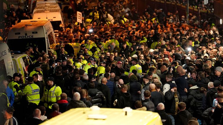 Police and fans outside the ground before the game. Pic: PA