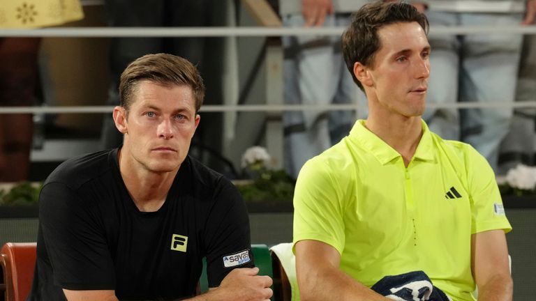 Britain's Joe Salisbury and Neal Skupski look dejected after the men's doubles final at Roland Garros