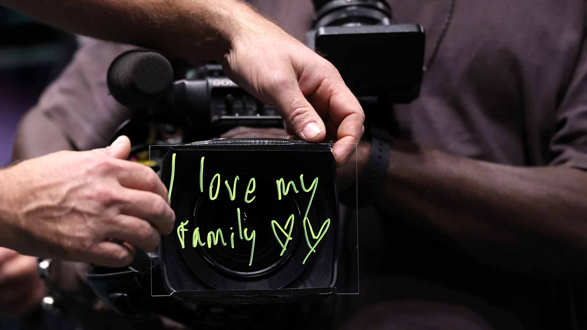Valentin Vacherot signs 'I love my family' after defeating Arthur Rinderknech in Paris.