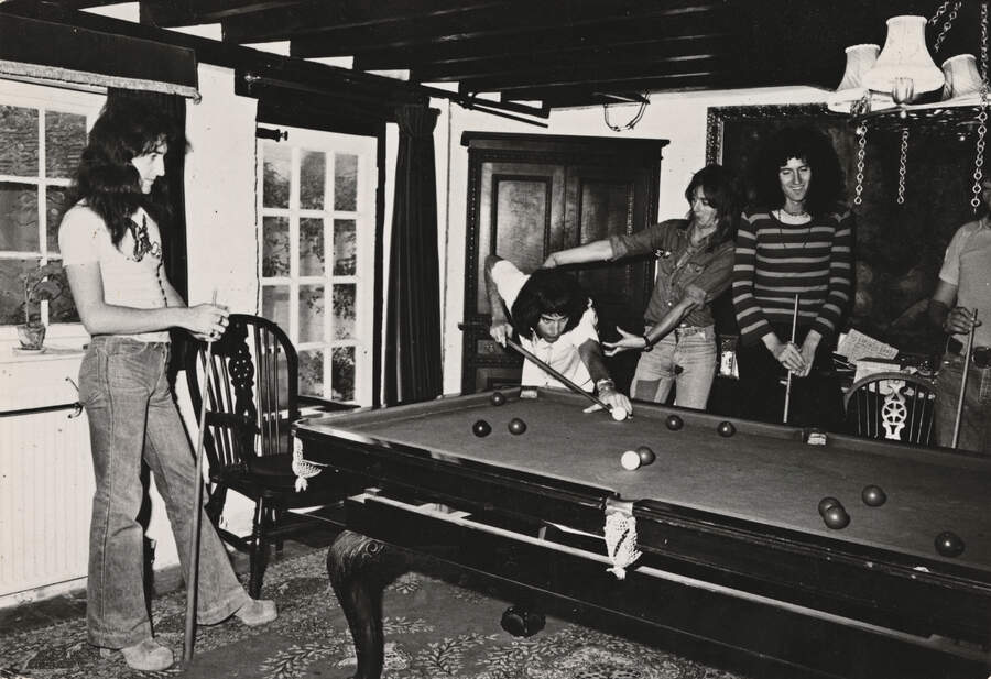 Queen playing snooker at Ridge Farm Studio during the recording of their album 'A Night At The Opera', Surrey, United Kingdom, 14th July 1975