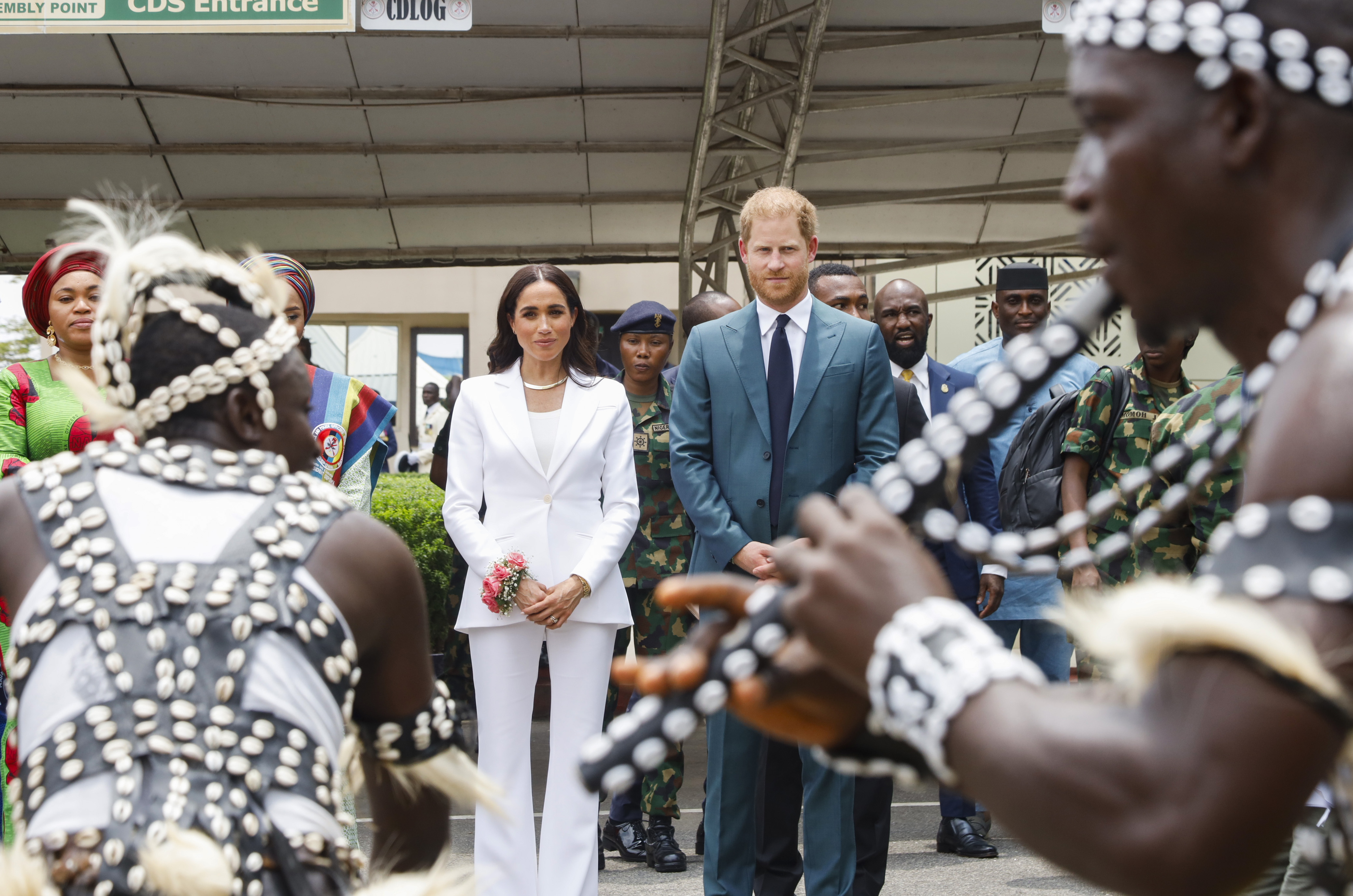 Meghan, Duchess of Sussex, and Prince Harry, Duke of Sussex, watch a performance in Abuja, Nigeria.