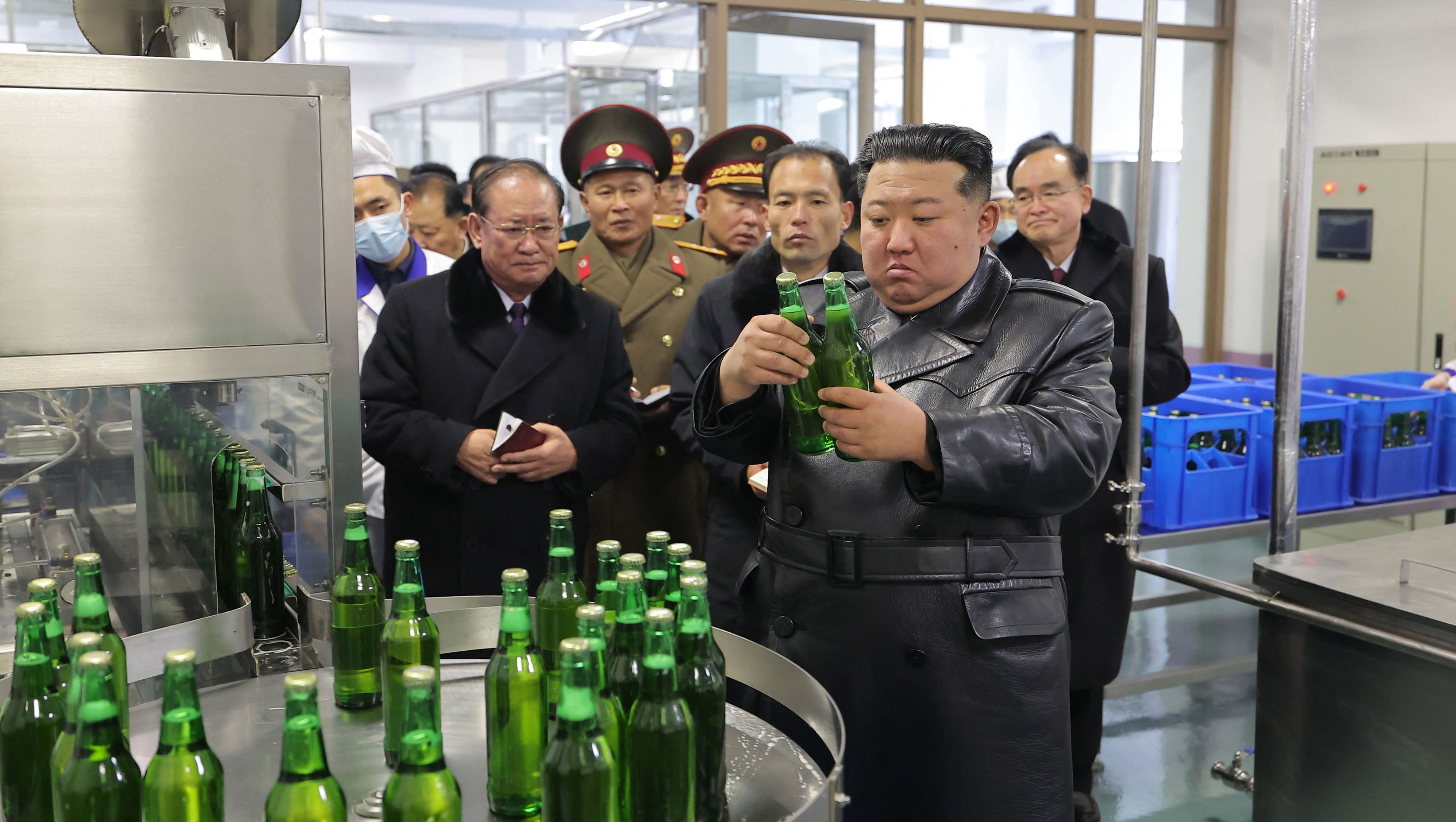 North Korean leader Kim Jong Un inspecting newly built regional industry factories.