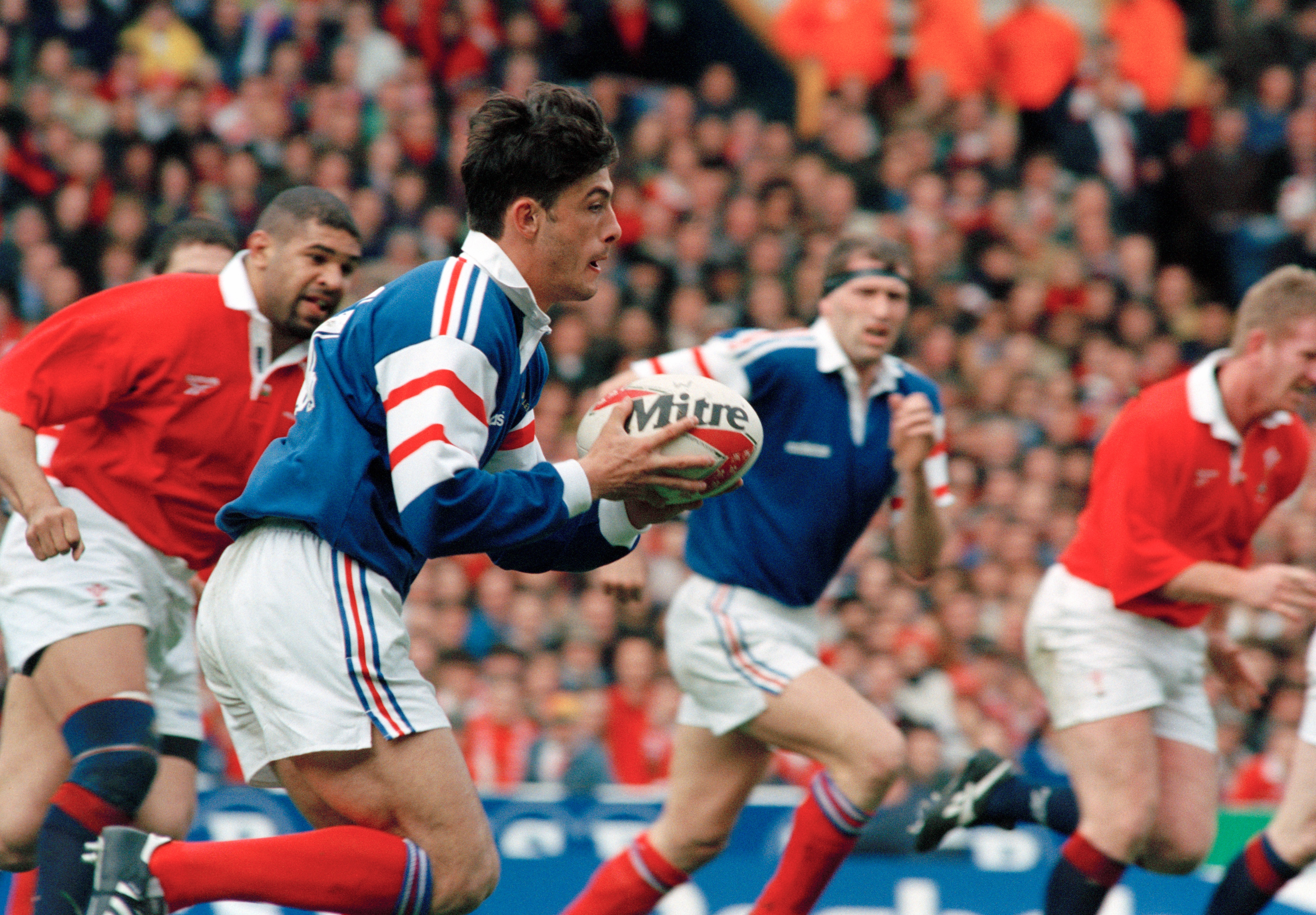 Xavier Garbajosa of France holding the ball during a rugby match against Wales.