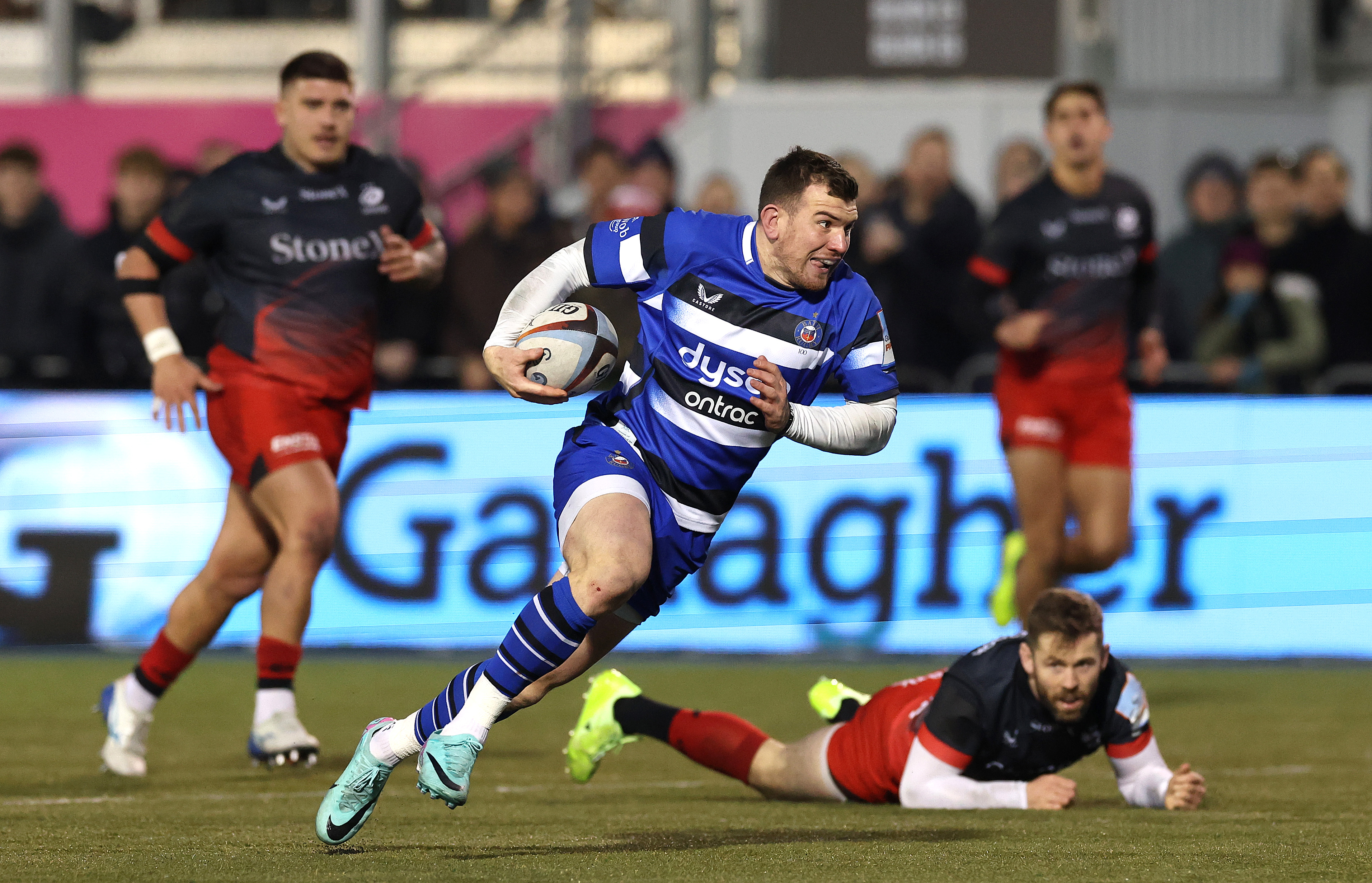 Ben Spencer of Bath charges upfield during a rugby match.
