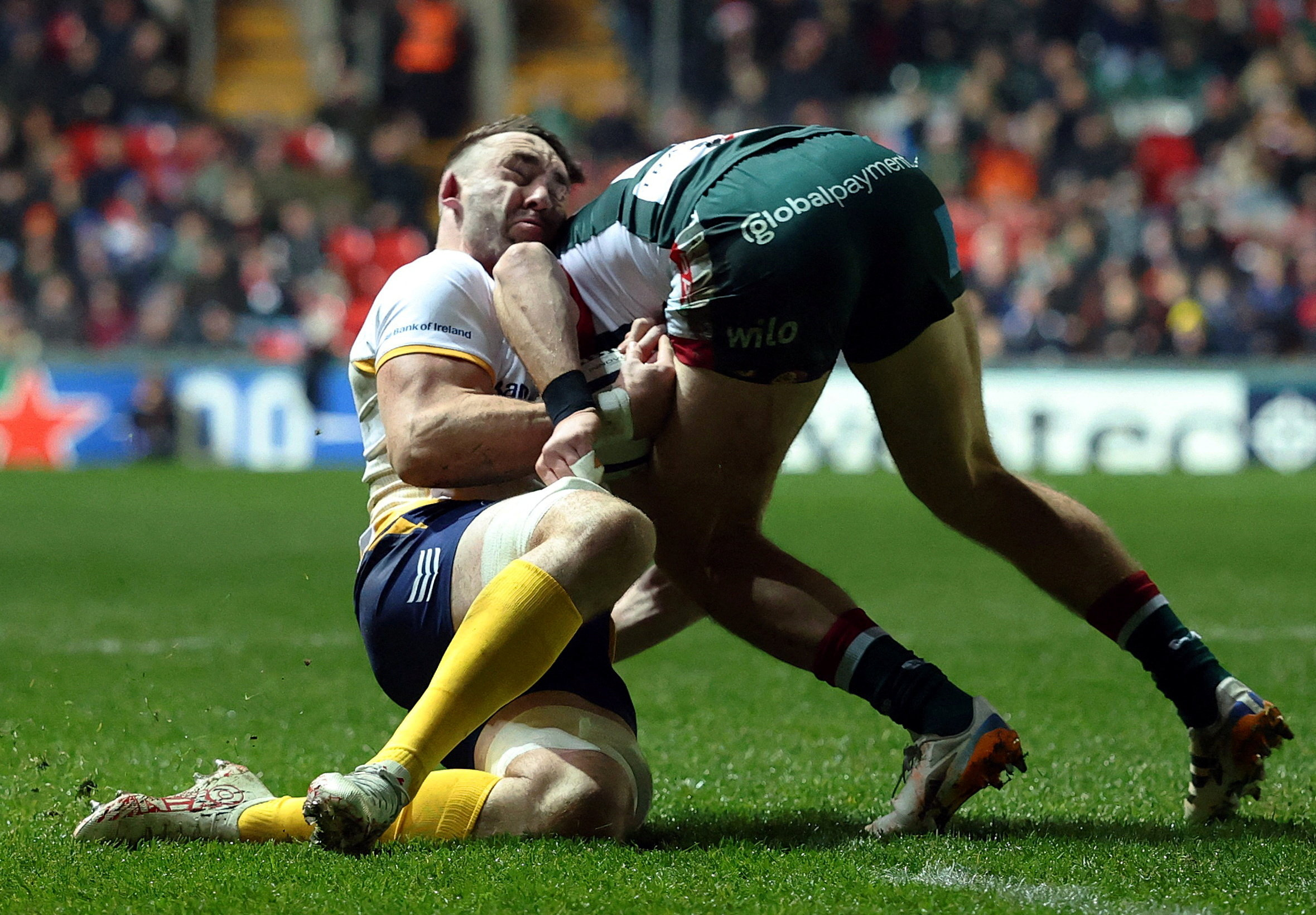 Leinster's Jack Conan tackles Leicester Tigers' Freddie Steward during a rugby match.