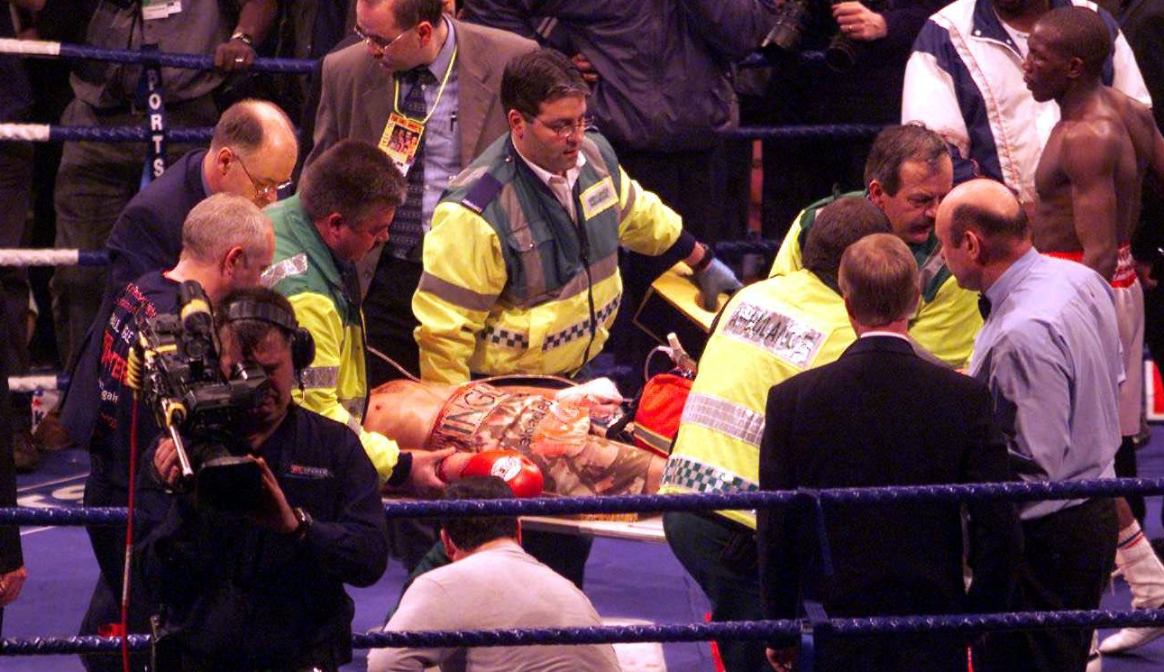 Paul Ingle being stretchered off after being knocked out by Mbulelo Botile during the IBF Featherweight Championship.