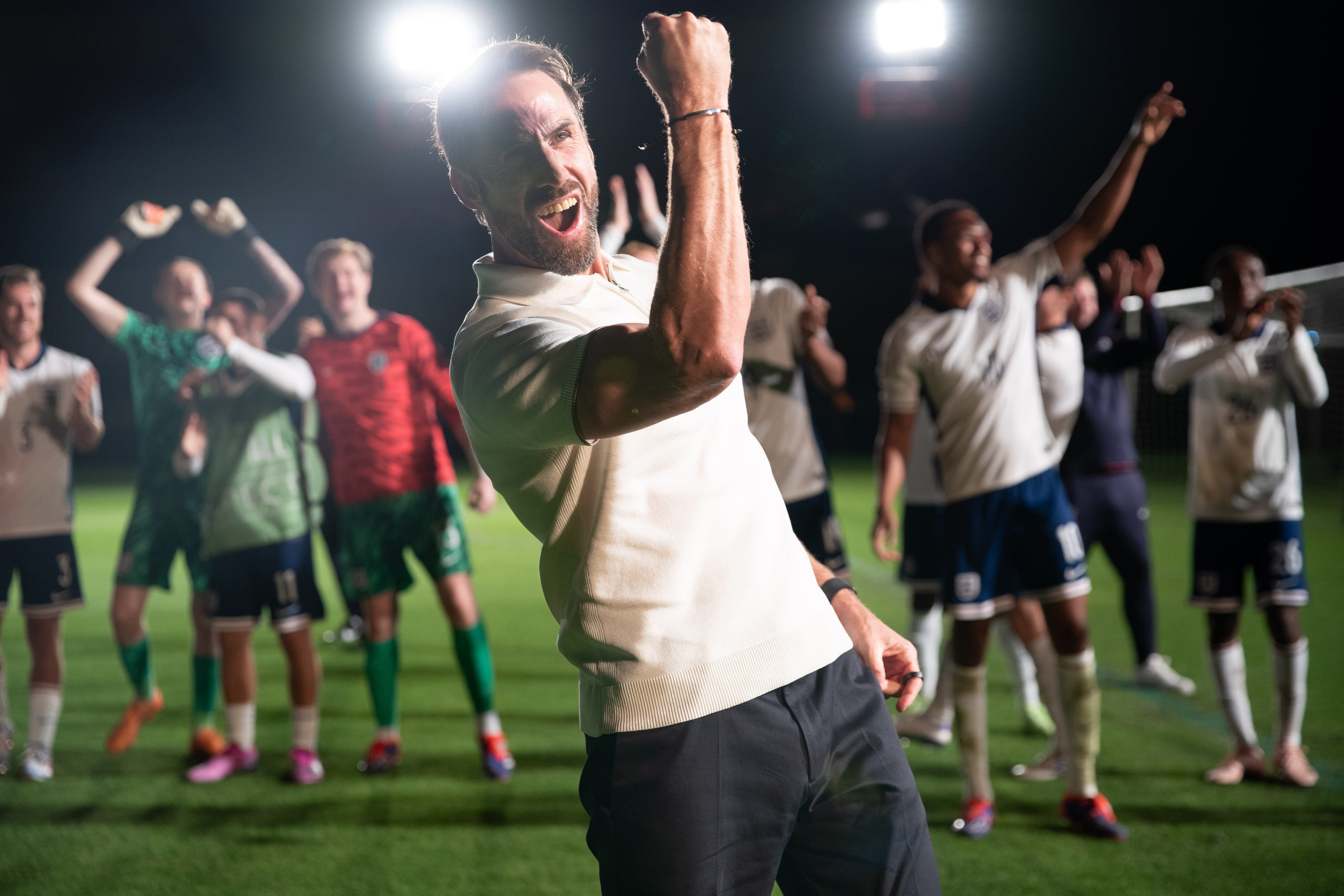 Joseph Fiennes as Gareth Southgate celebrating with his soccer team.