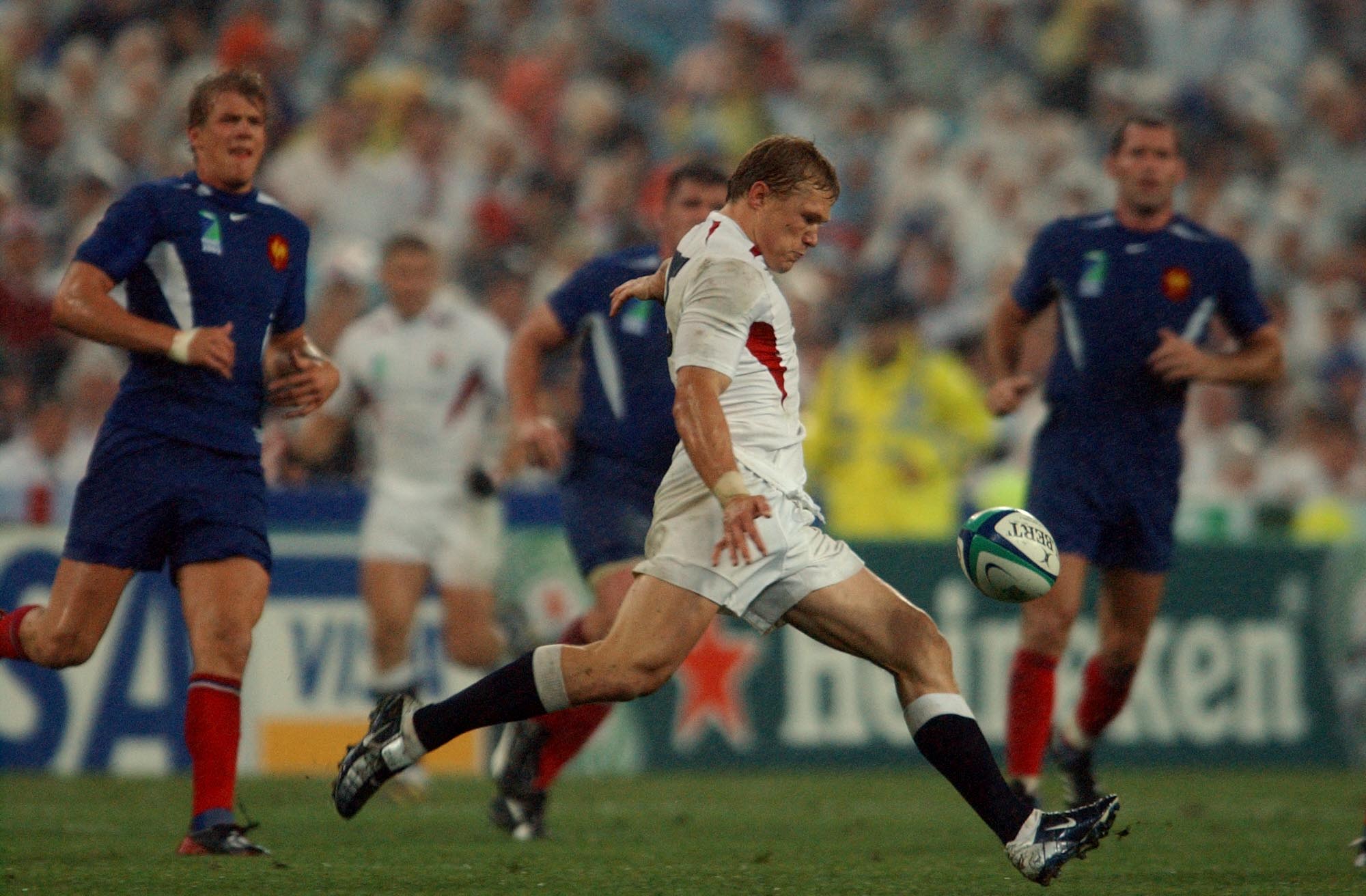 England's Josh Lewsey kicking the ball ahead of France in a Rugby World Cup semifinal.