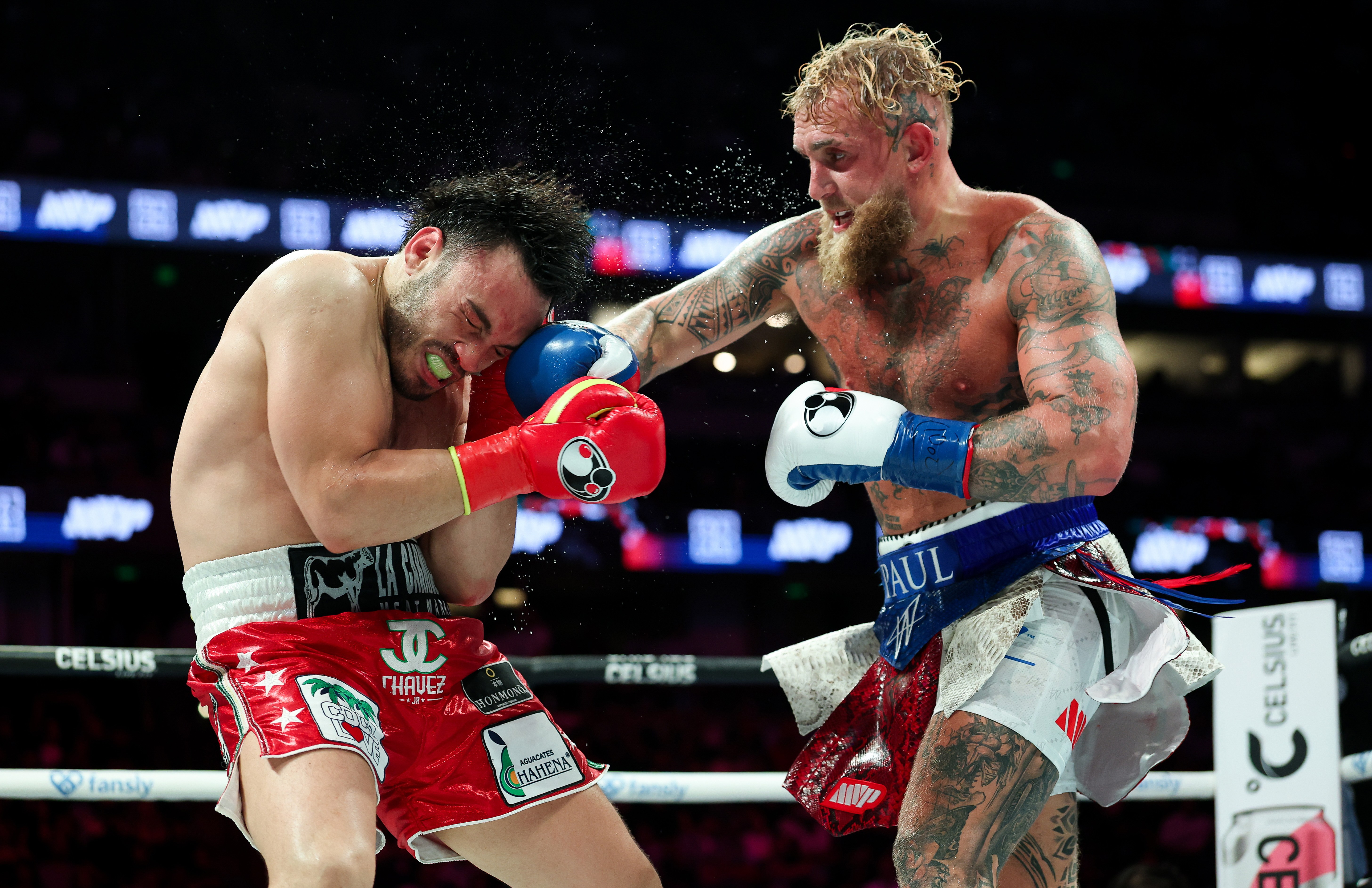 Jake Paul lands a punch on Julio Cesar Chavez Jr. during their fight.