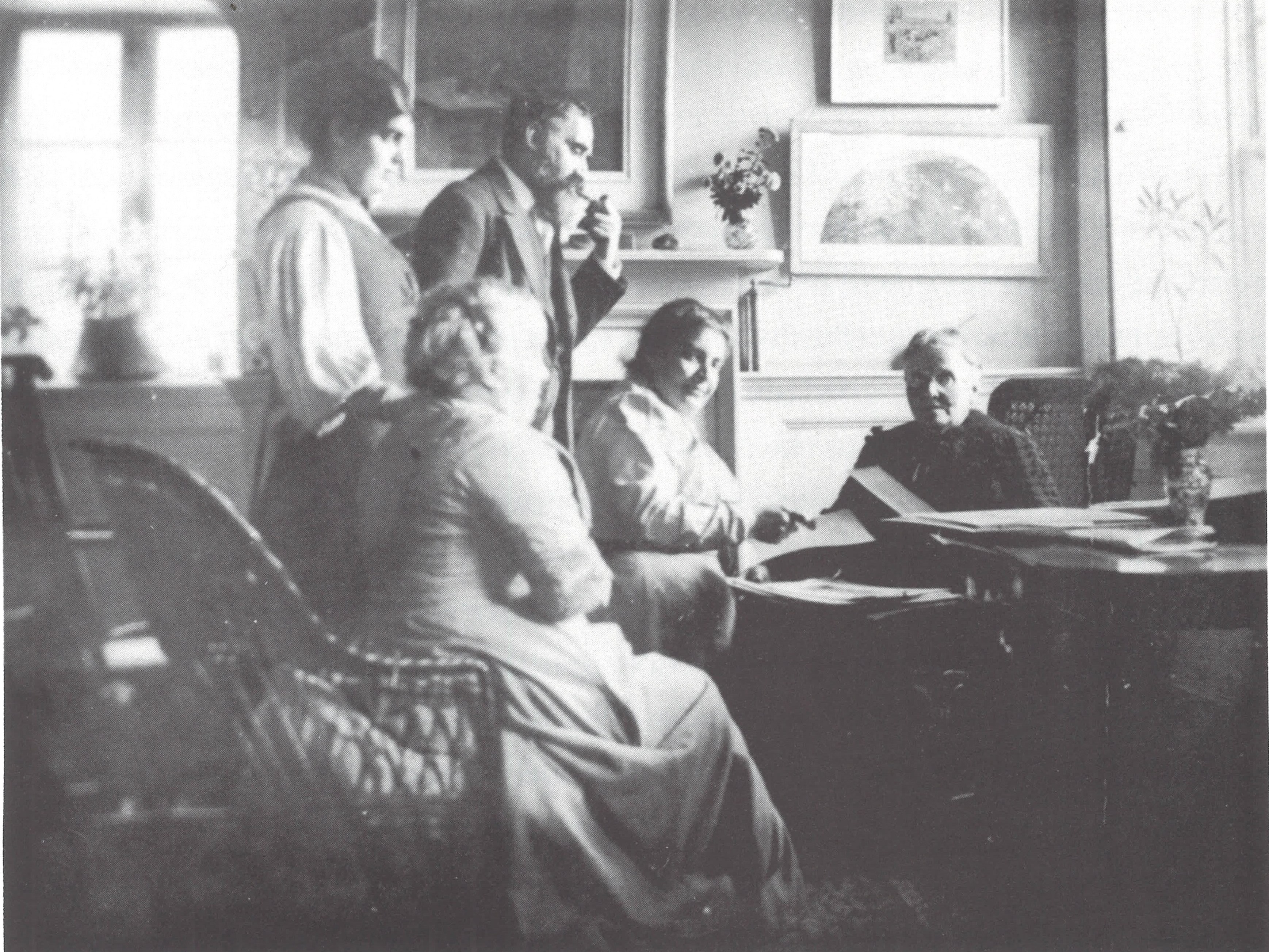 Lucien Pissarro in the Sitting Room of The Brook with other people.