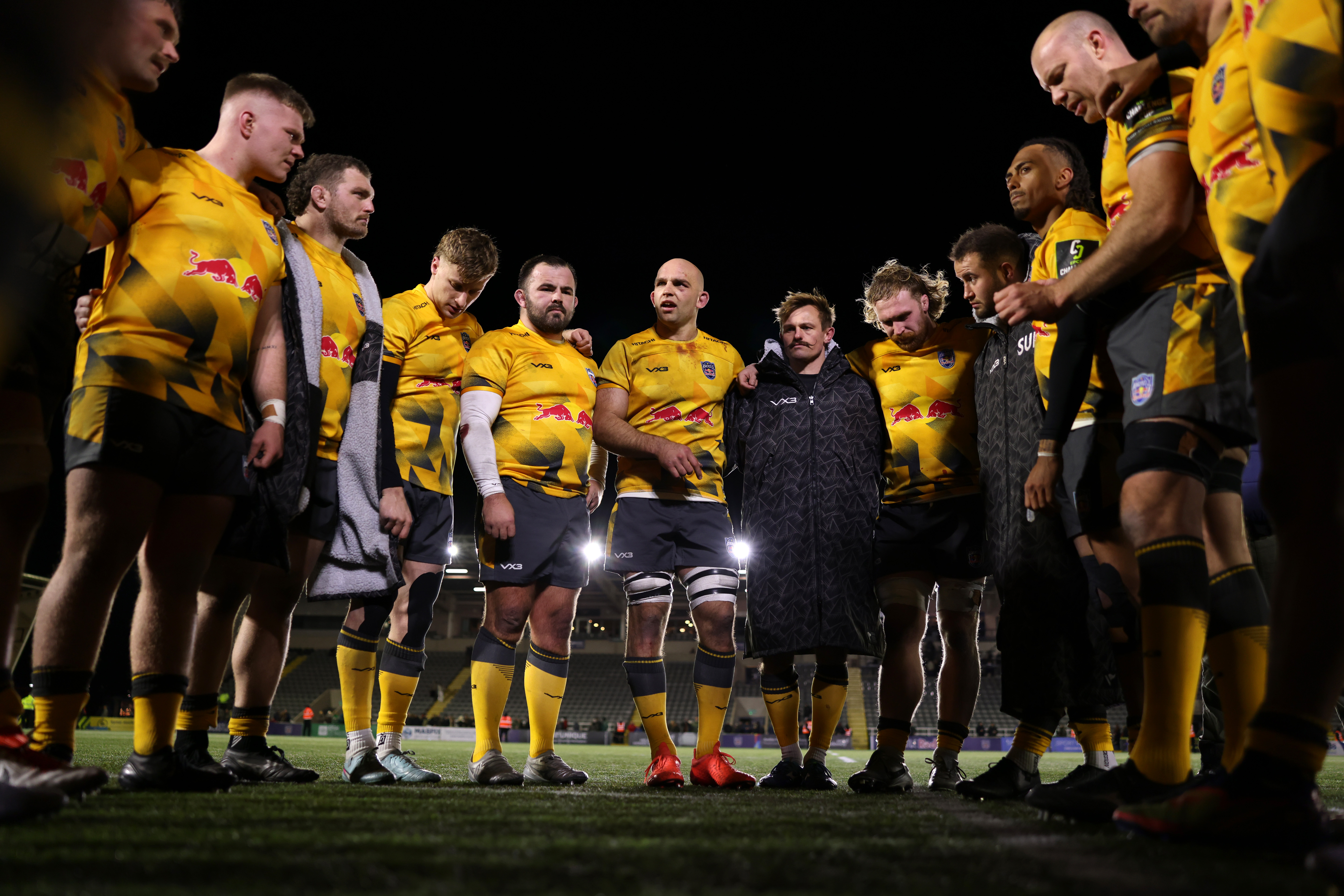 Tom Christie of Newcastle Red Bulls giving a team talk in a huddle following victory in an EPCR Challenge Cup match.