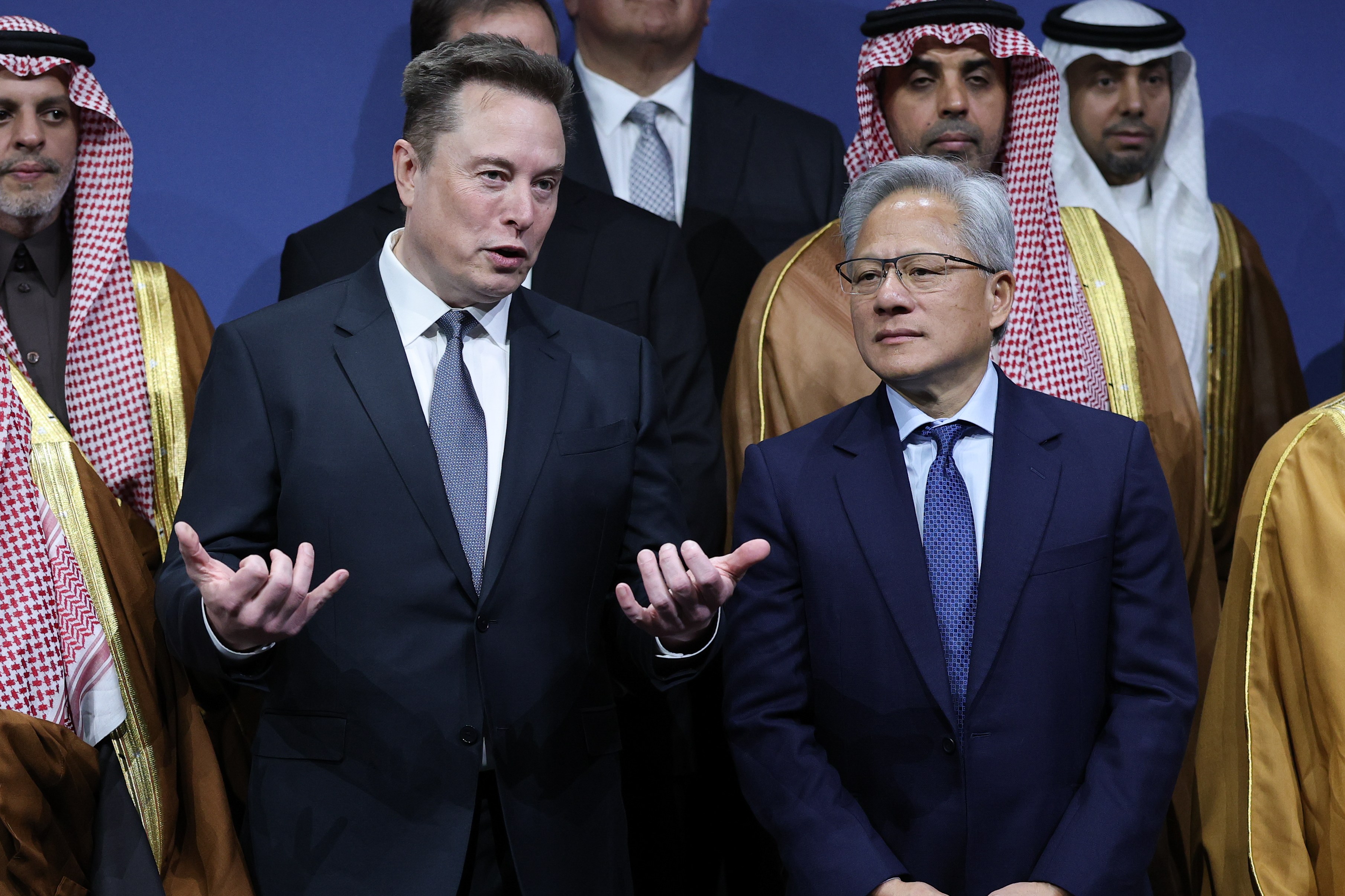 Tesla CEO Elon Musk talks with Nvidia CEO Jensen Huang at the U.S.-Saudi Investment Forum.