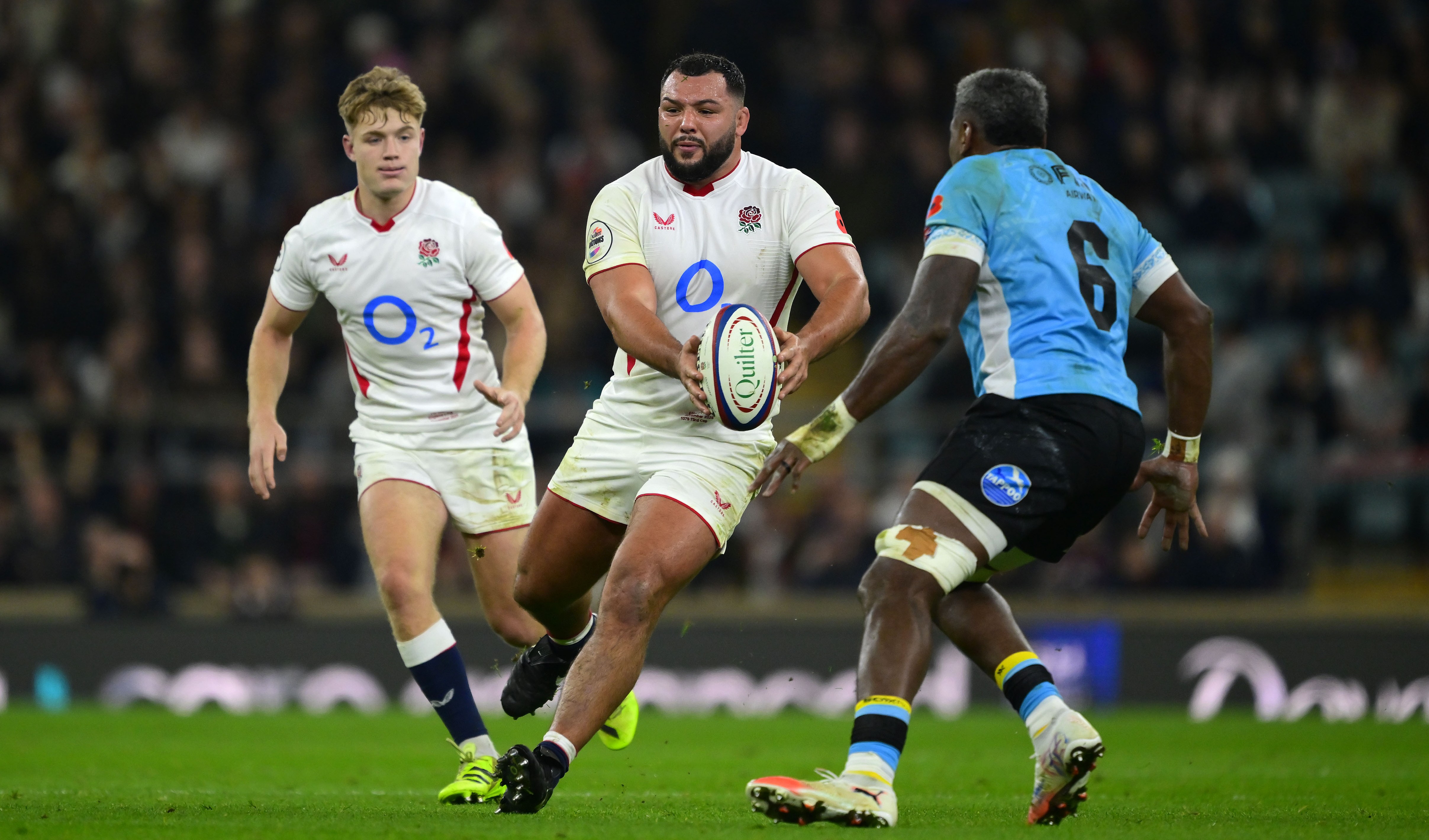 Ellis Genge of England with the ball during a rugby match.