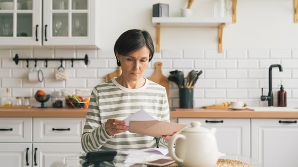 Senior adult worried by prices. 