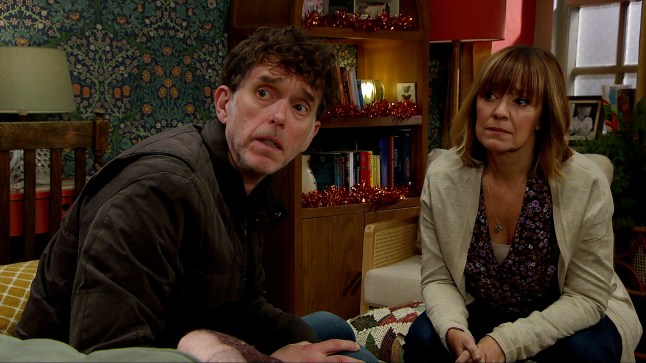 Marlon and Rhona look worried in Emmerdale