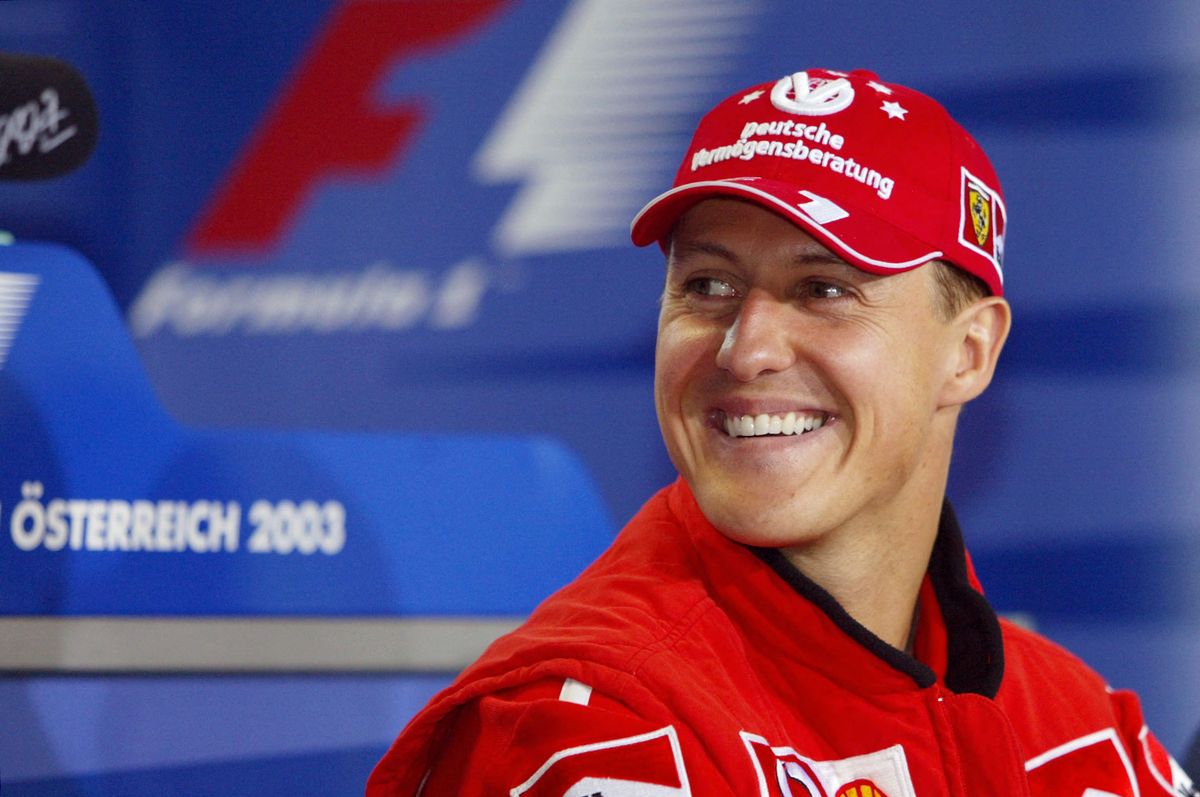Michael Schumacher smiles during a press point in the media center of the Spielberg racetrack, 15 May 2003