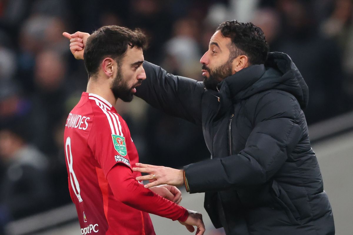 Manchester United manager Ruben Amorim with Bruno Fernandes during the Carabao Cup Quarter Final match between Tottenham Hotspur and Manchester United at Tottenham Hotspur Stadium on December 19, 2024 in London, England. 
