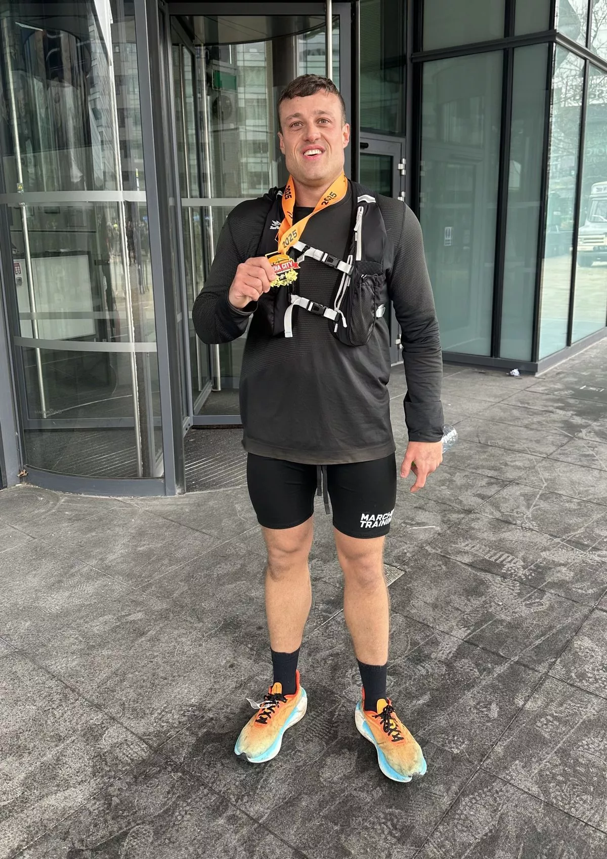 Ryan with his race medal (Kennedy News and Media)