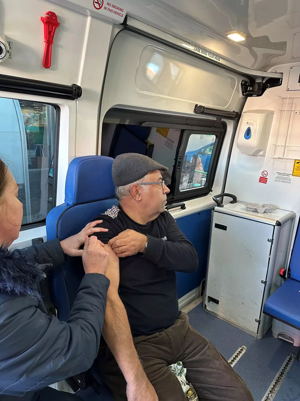 Karen vaccinating a patient during a voluntary outreach clinic