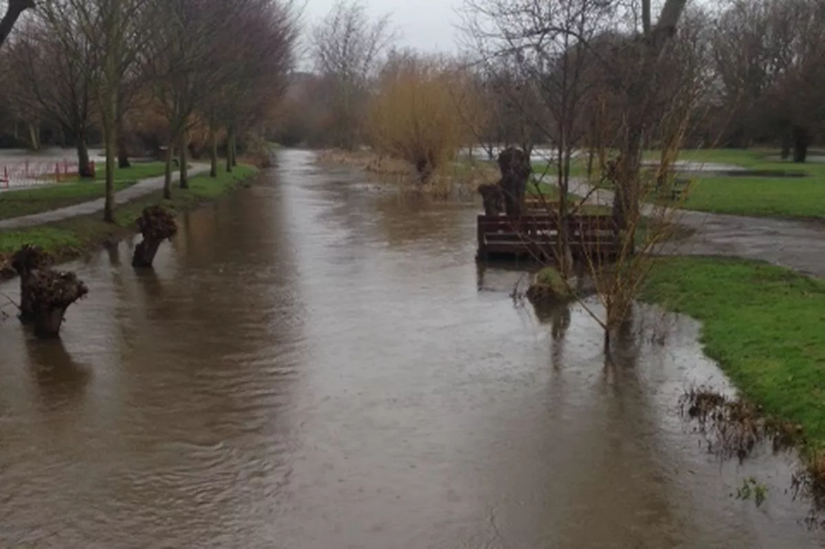 Images of the River Bourne is spilling over in Chertsey from 2014