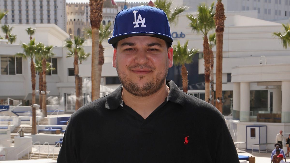 Rob Kardashian wearing a blue baseball cap