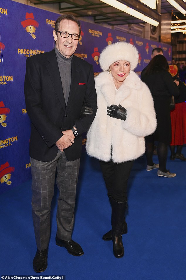 Dame Joan Collins made a glamorous entrance alongside her husband Percy Gibson as they attended the Paddington: The Musical opening night at the Savoy Theatre