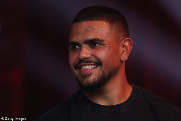 Footy great Latrell Mitchell (pictured) was also seen ring side watching on the fight