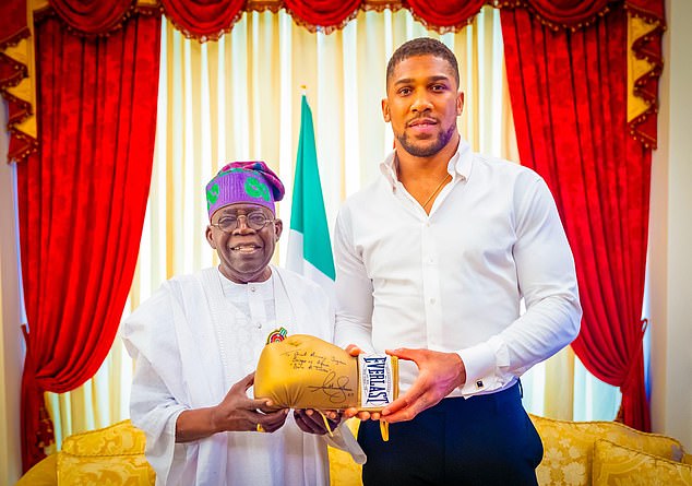 Nigeria's president Bola Ahmed Tinubu, left, confirmed he had spoken to both Joshua and his mum in a phone call on Monday and offered his condolences to the boxer