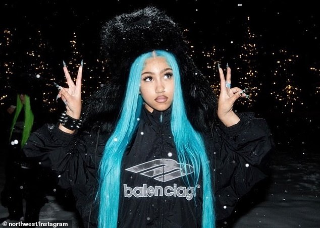 She wore a black Balenciaga jacket as well as a black fuzzy hat on top of her head that had 'North' embroidered on the front